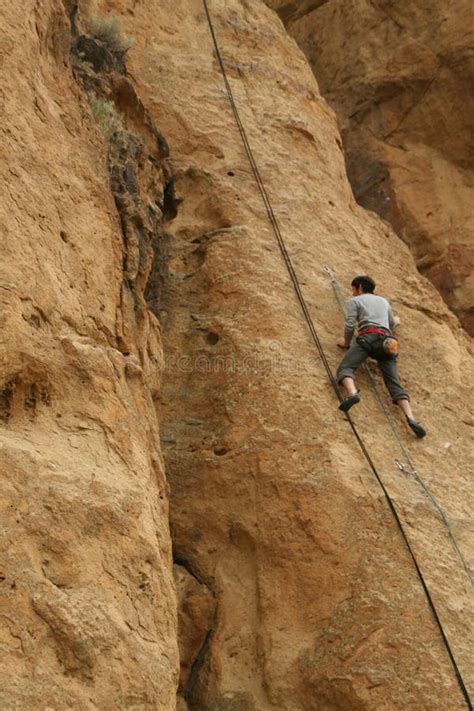 rock climber works his way up a sheer cliff editorial photo image of climber sheer 34660446