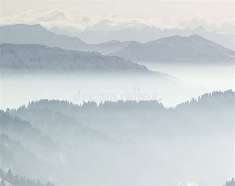 Snow Mountains In Low Lying Inversion Valley Fog Silhouettes Of Foggy