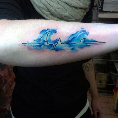 Blue Colored Waves Shaped Heart Rhythm Tattoo On Arm Tattooimagesbiz