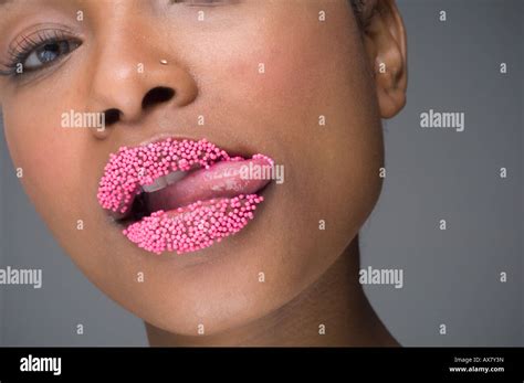 African Woman Licking Sprinkles Off Lips Stock Photo Alamy