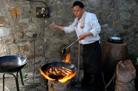 What is the point of using a wok, versus a deep frying pan ...