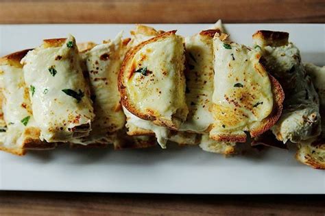 Rotate the bread 90 degrees and cut in the other direction. ree drummond cheesy garlic bread
