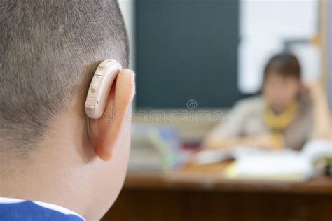 Students Who Wear Hearing Aids To Increase Hearing Efficiency Stock