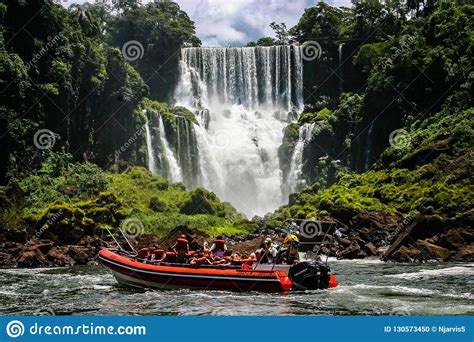 Speed Boat Rides Under The Water Cascading Over The Iguacu Falls In