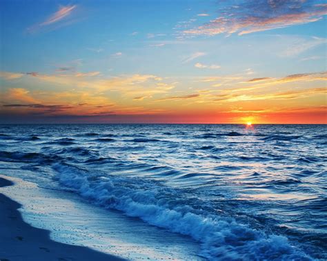 Sunset over waves background video loop. Wallpaper Sunset sea beach, waves, blue, orange sky ...