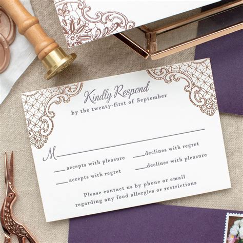 The Wedding Stationery Is Laid Out On Top Of Purple And White Paper