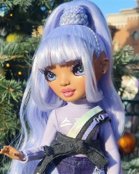 A Close Up Of A Doll Near A Christmas Tree