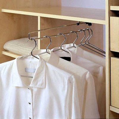 This rail pulls out, allowing you access to the clothes hanging up at the back. Wardrobe Pull Out Clothes Hanger Rail / Extending Rail ...