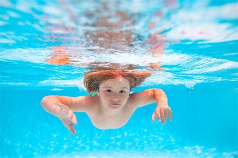 Child In Pool In Summer Day Child Boy Swim Under Water In Sea Kid