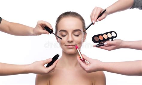 Hands Of Visagistes Doing Makeup For Beautiful Girl Isolated Stock