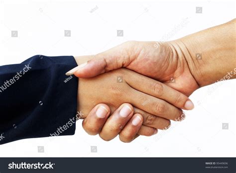 Close Up Of Hands Shake Between Two Business People Stock Photo