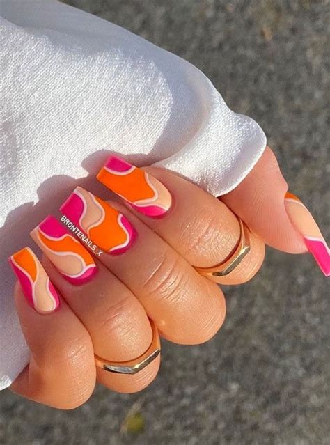 The Prettiest Summer Nail Designs We Ve Saved Bright Pink And Orange Swirl Nails Nails Orange