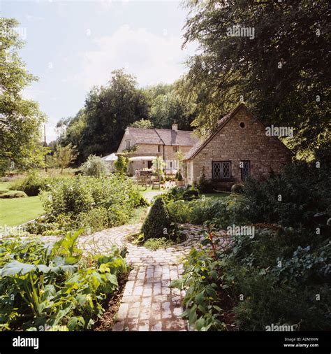 Cottage Exterior In Country Garden With Path Stock Photo Alamy