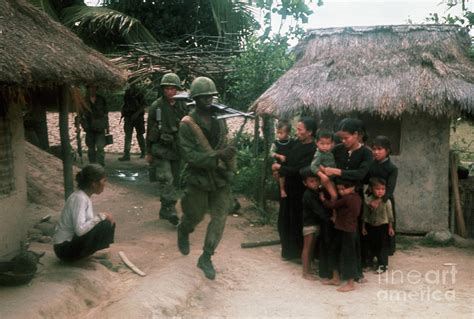 Us Soldiers Enter Vietnamese Village By Bettmann