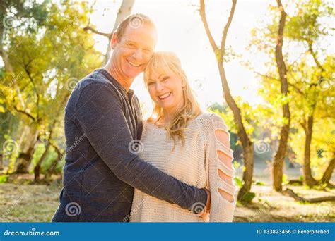 Happy Middle Aged Caucasian Couple Portrait Outdoors Stock Photo