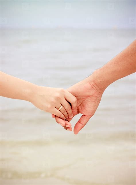 Couple Holding Hands On Beach Stock Photo 100036 Youworkforthem