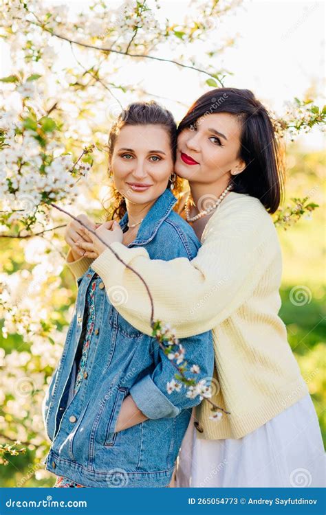 Two Attractive Women Hugging In A Spring Garden Stock Image Image Of Beautiful Togetherness