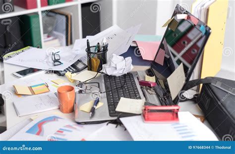 Messy And Cluttered Desk Stock Photography 97668344
