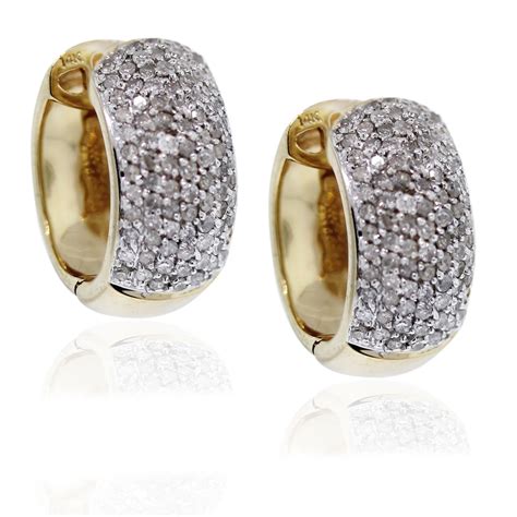 The measure 20 mm in diameter. 14kt Yellow Gold Diamond Huggie Earrings