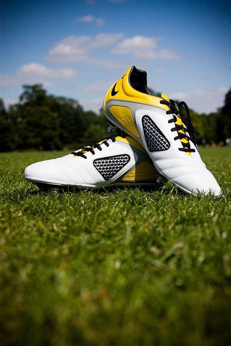 Hd Wallpaper Pair Of White And Yellow Nike Soccer Cleats On Field