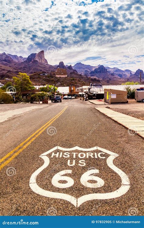 Historic Us Route 66 With Highway Sign On Asphalt And A Panoramic View