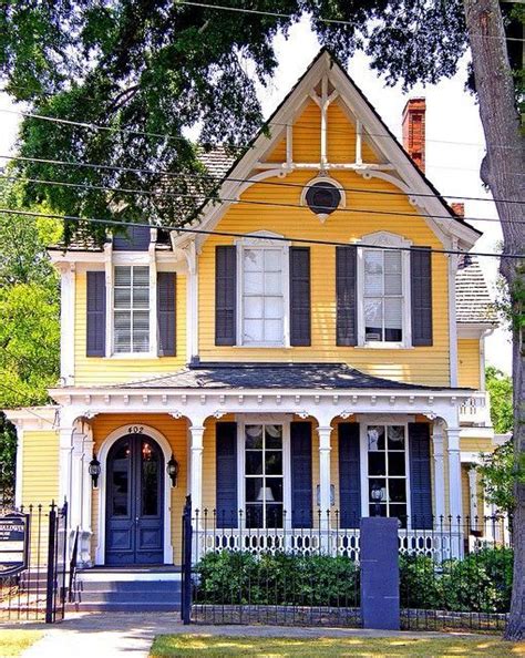 There are also many other pretty victorians encircling the lovely park. yellow Victorian house | Victorian homes, House styles ...
