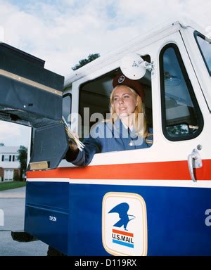Female United States Postal Service Carrier Delivering Mail In Stock Photo Alamy