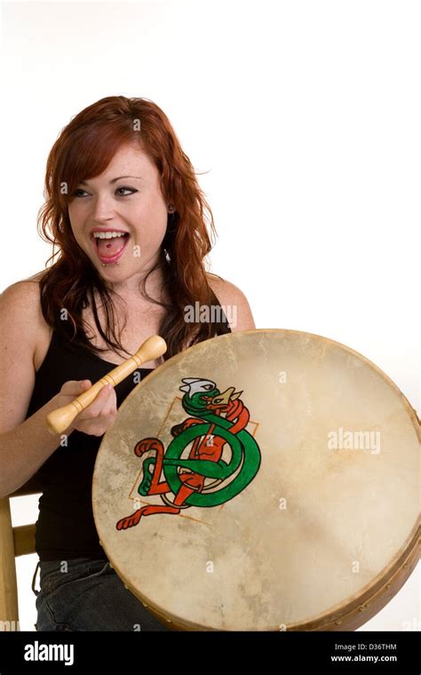 Young And Modern Red Headed Girl Playing Bodhran Drum Stock Photo Alamy