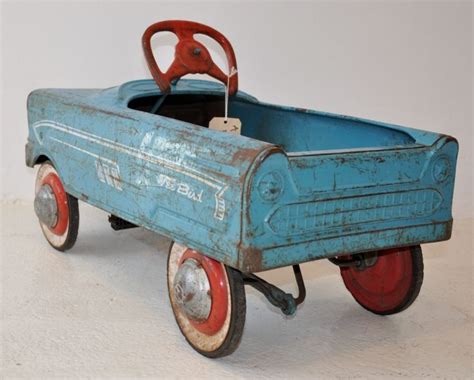 Retro Pedal Car in blue with red wheels. | Vintage pedal cars, Pedal