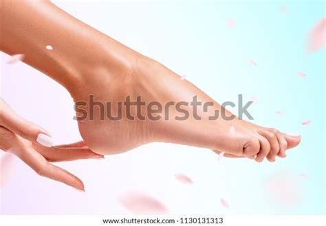 Frau Berührt Ihre Füße Auf Hintergrund Stockfoto 1130131313 Shutterstock