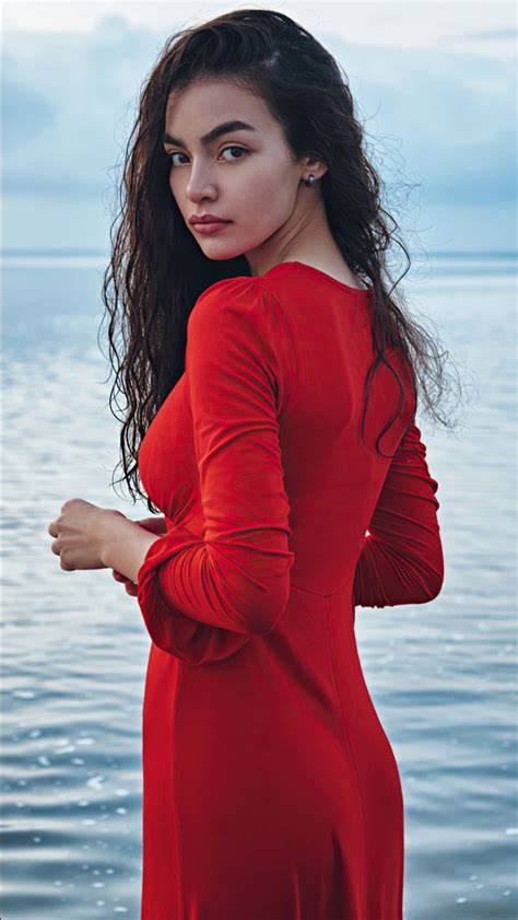 beautiful girl model is standing in water background wearing red dress 4k hd girls wallpapers