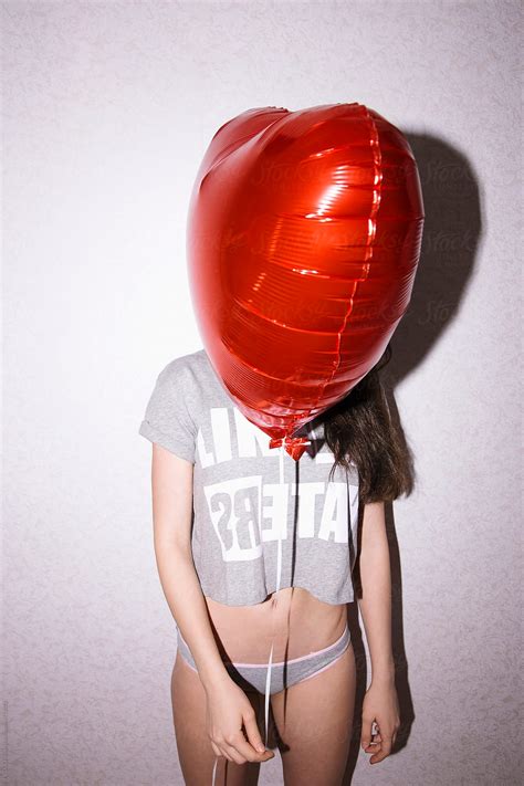 Babe Woman Holding Red Balloon In Front Of Her Face By Stocksy Contributor Danil Nevsky