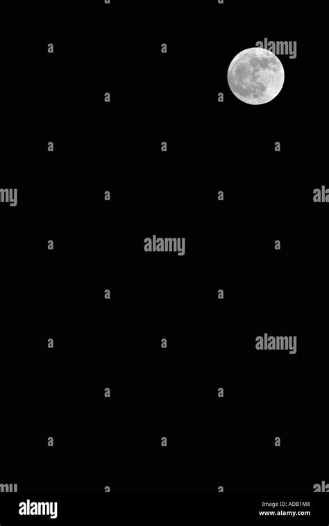 Moon Against A Dark Sky Stock Photo Alamy