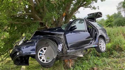 The Car Wrapped Around A Tree Due To The Force Of The Impact