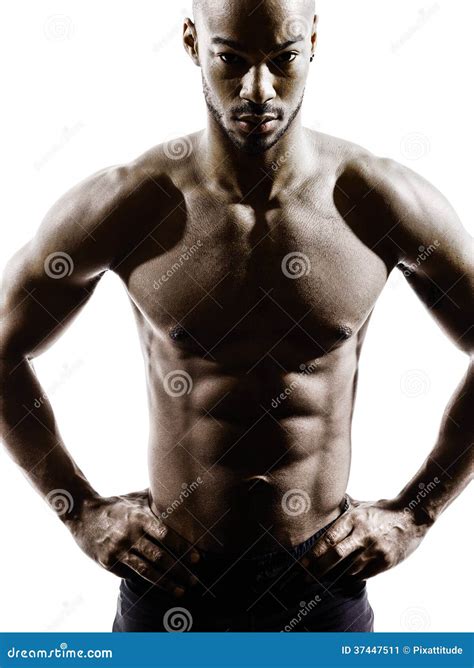 Silhouette Of Athletic African Man Showing Naked Muscular Body Stock