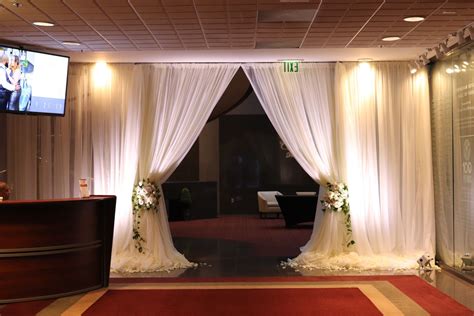 Make A Grand Entrance For Your Guests By Adding White Drapery And