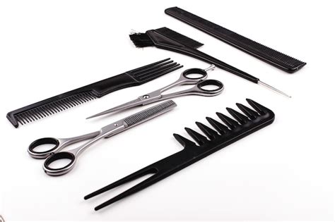 Free Photo Scissors And Combs For Hair Cut And Treatment Lie On A