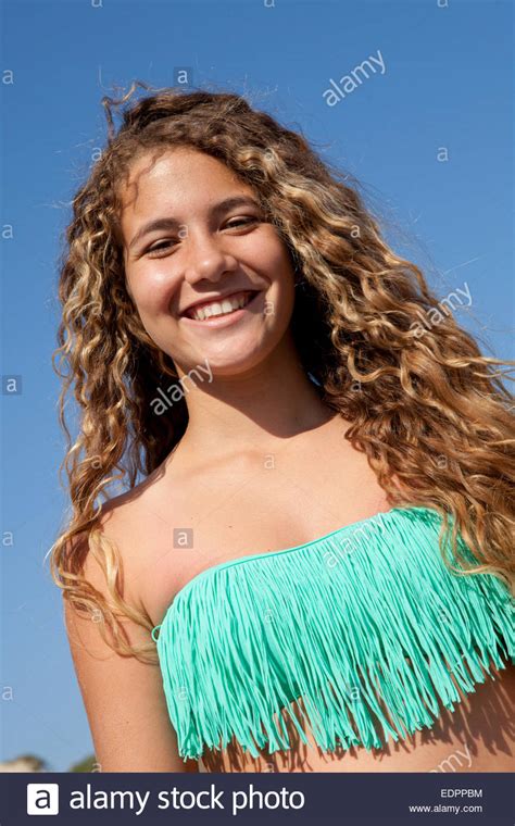 Beautiful Girl With Blond Curly Hair Wearing A Fringe