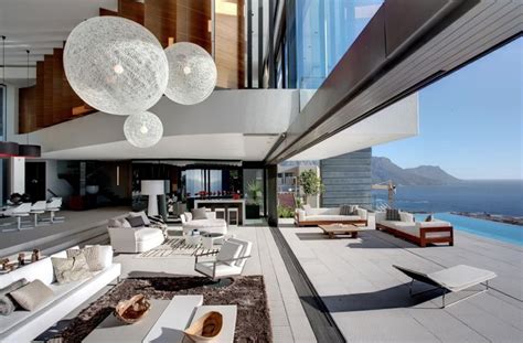 The kitchen in this open design is just a step up from the living area. Contemporary open plan living area | Interior Design Ideas