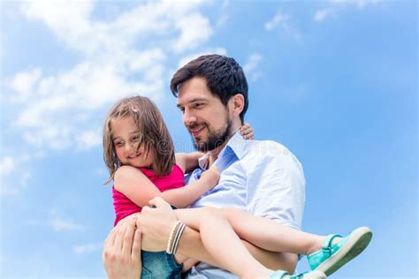 Father Carrying Daughter Protecting Her Stock Photos Free And Royalty