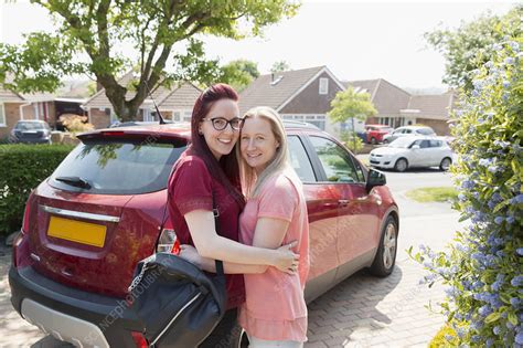 Lesbian Couple Hugging In Driveway Stock Image F0227345 Science