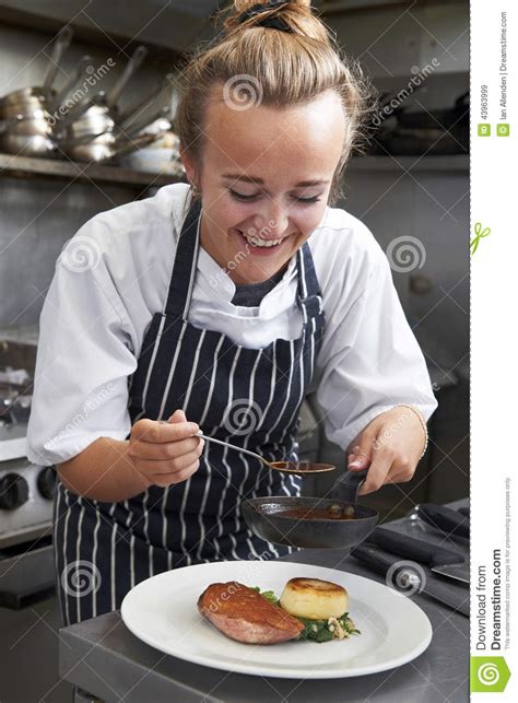 Trainee Chef Working in Restaurant Kitchen Stock Image - Image of