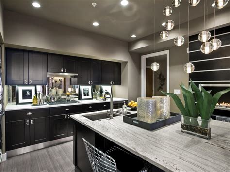 The open shelves are also black marble. Gray Contemporary Kitchen With Black Cabinets | HGTV