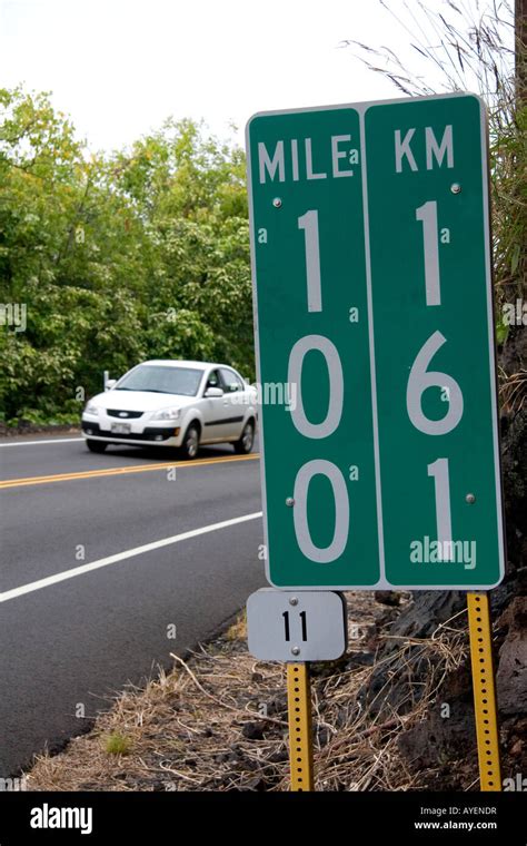 Roadside Mile Marker Showing Measurement In Miles And Kilometers On