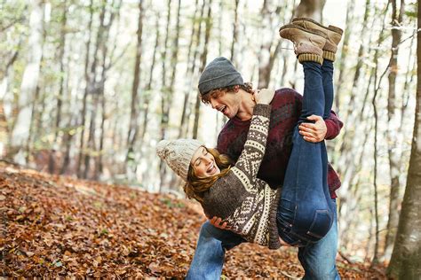 Couple In Love Having Fun Together On The Woods In Autumn By Stocksy