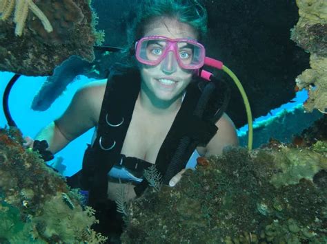 Female Scuba Diver Posed Underwater On A Shipwre Stock Photo By
