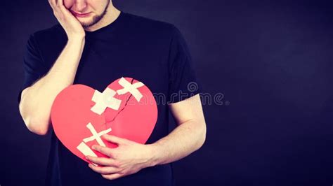 Very Sad Man Holding Broken Heart Stock Image Image Of Breaking