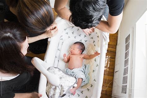 Asian Newborn Baby In A Crib In Everyones Attention Del Colaborador