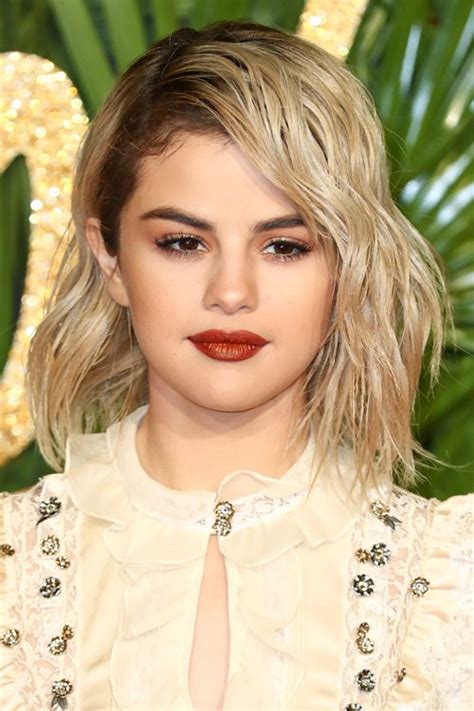 Discover more posts about selena gomez blonde. Selena Gomez Wavy Platinum Blonde Bob, Dark Roots, Shaggy ...