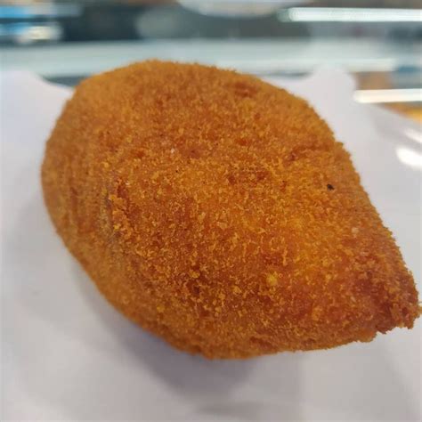 A Fried Food Item Sitting On Top Of A White Napkin